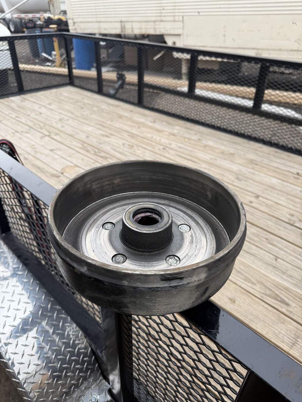 New brake drum ready to install on a utility trailer